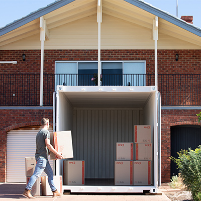 loading 20ft shipping container in driveway