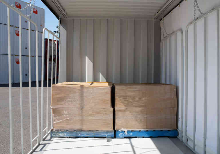 Two Australian pallets sitting side by side in an SCF container