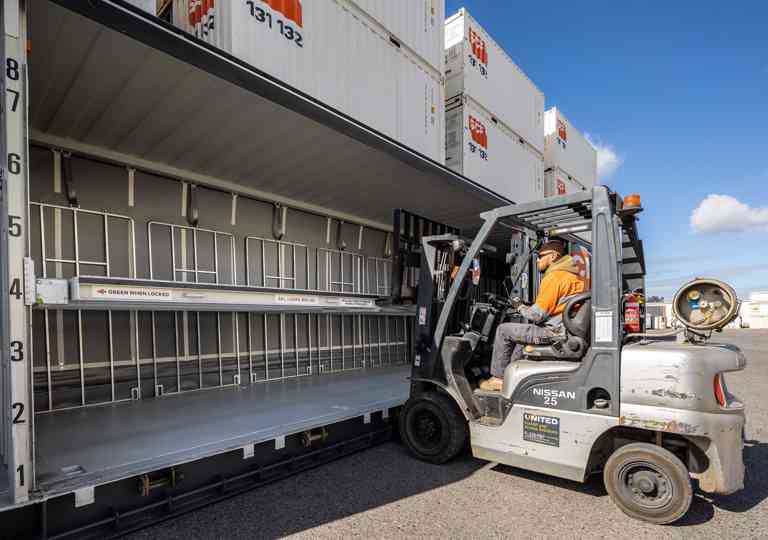 Mezzanine deck in an SCF tautliner container being adjusted by a forklift
