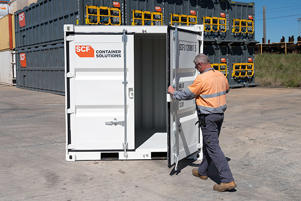 An 8ft SCF shipping container being opened.