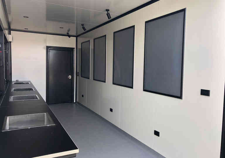 An internal view of the Project Air Bar, complete with sinks and marketing collateral holders